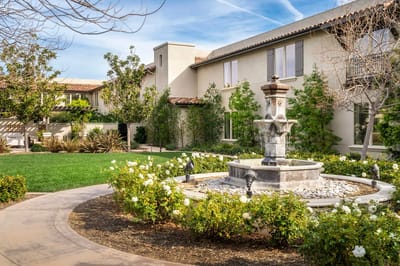Beautiful outdoor garden with a fountain and greenery