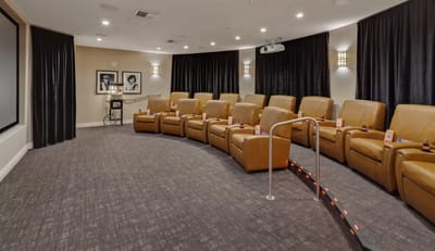 Cozy private cinema with reclining chairs