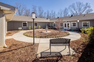 Outdoor courtyard with benches and walking path