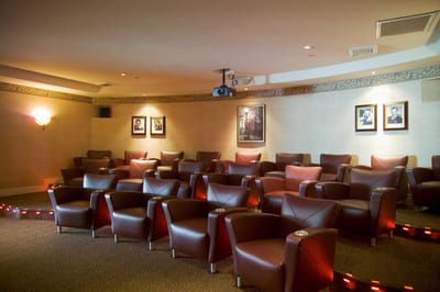 Interior of a movie theater with comfortable chairs