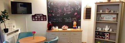 Cozy common area with a chalkboard and refreshments