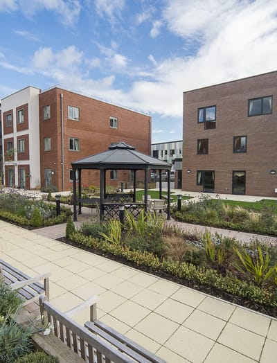 Outdoor garden area with a gazebo and benches