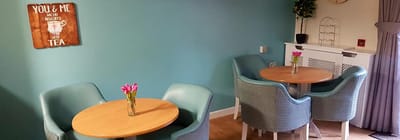 Cozy common area with tables and flowers