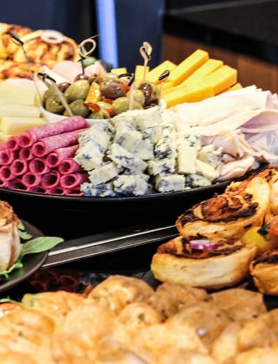 An elegant assortment of charcuterie and cheeses