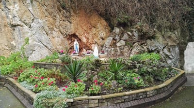 Garden area with flowers and religious statues