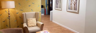 Bright interior lounge area with seating and artwork