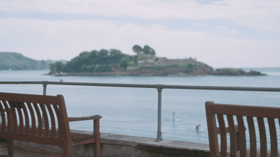 Scenic view of the ocean from a bench