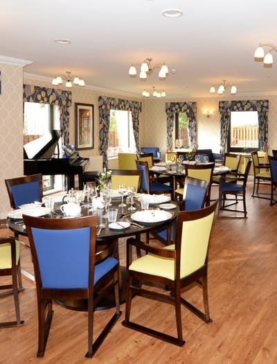 Elegant dining room setup with tables and chairs