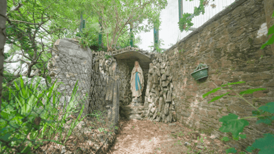 Outdoor garden space with a statue