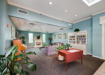 Interior common area with seating and a bookshelf