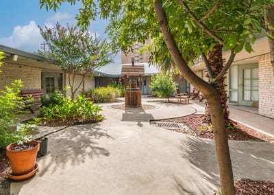 Quiet outdoor courtyard with plants and seating