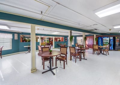 Interior view of a common area with seating tables