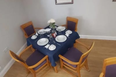 Dining table set for a meal in a senior living facility