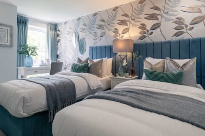 A beautifully decorated twin bedroom in a senior living facility