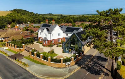 Aerial view of Place Farm House with gardens and entrance