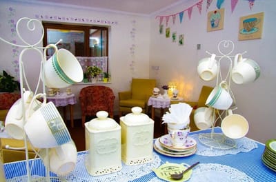Cozy tea corner with decorative cups and teapots