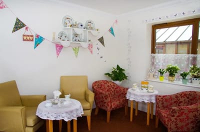 Cozy common area with chairs and decorative items