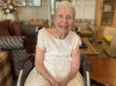 Senior resident smiling in a common area