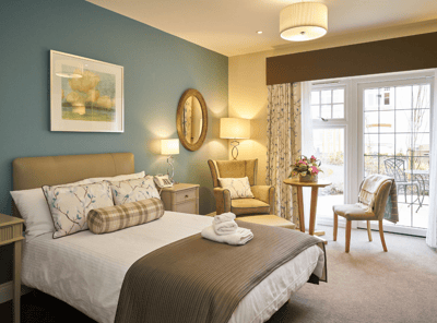 Bright, inviting resident room with outdoor access