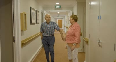 Residents walking together in a hallway