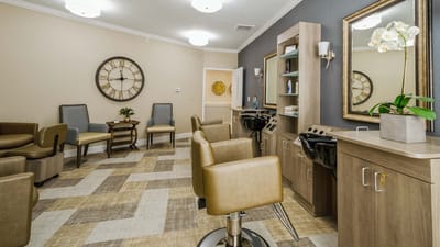 Hair salon area with styling stations and seating