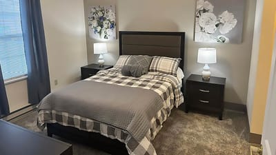 A cozy private resident room with a bed and decorations