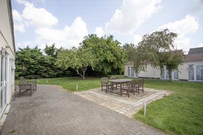Outdoor space with seating and greenery