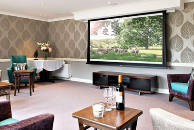 A cozy common area with seating and a view.