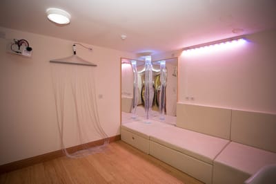 An interior room with soft lighting and seating area