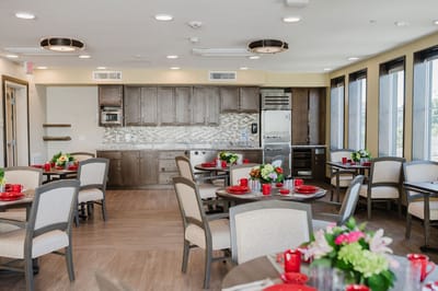 Elegant dining room setup with tables and flowers