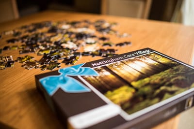 Puzzle game in a common area of Nottingham Care Village