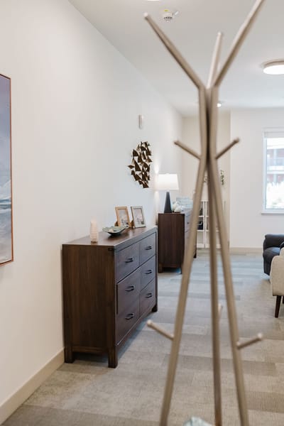 Bright and inviting interior hallway with furniture