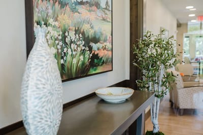 Interior decor with a floral painting and greenery