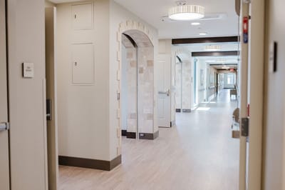 Bright hallway with arches and light fixtures