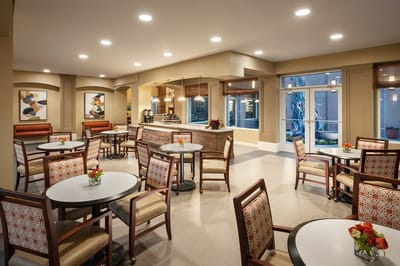 Bright dining area with tables and chairs