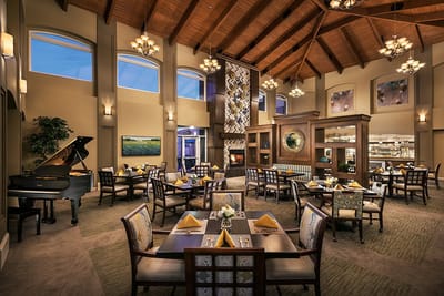 Elegant dining room with wooden beams and bright windows