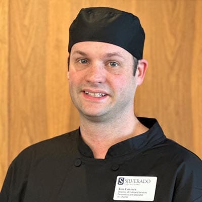 Staff member in kitchen attire at Silverado Community