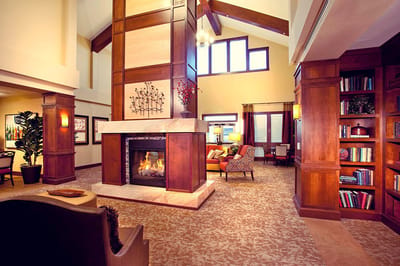 Bright and welcoming common area with a fireplace