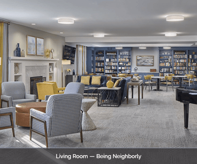 Bright common area with seating and bookshelves