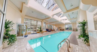 Indoor swimming pool area with natural lighting