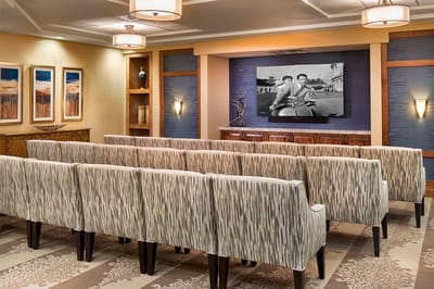 Common area with seating and a large television