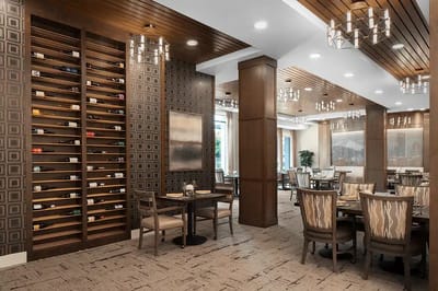 Elegant dining room with wine display and tables