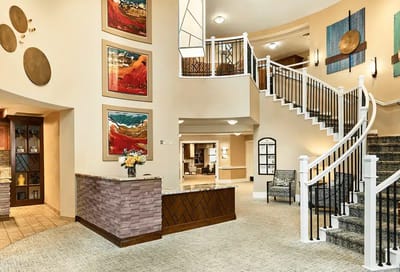Interior lobby of a senior living facility with artwork
