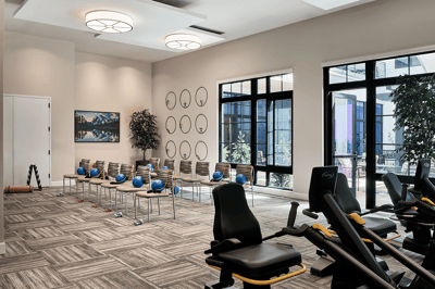 Activity room with exercise equipment and seating