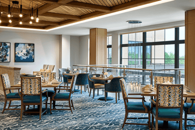 Elegant dining room setup with tables and chairs