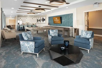 Bright common area with cozy seating and modern decor