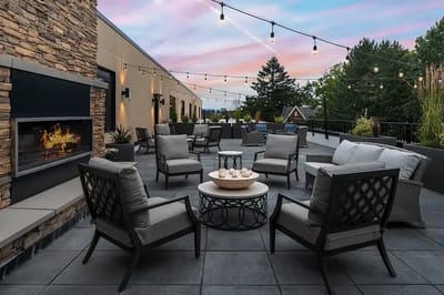 Outdoor patio area with seating and evening lights