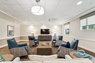 Bright common area with seating and television