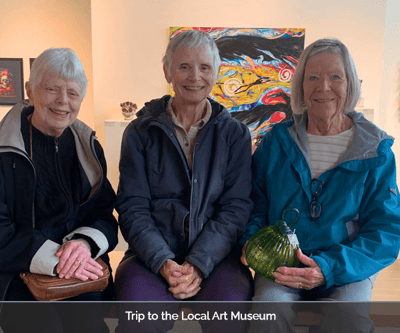 Three residents enjoying an art museum trip
