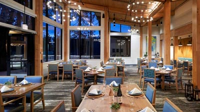 Bright dining room with tables set for meals
